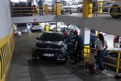 Otoparkta otomobilin altında kalan genç kadın yaralandı
