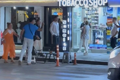 Caddede "Kafanı keserim" diyerek tehdit etti
